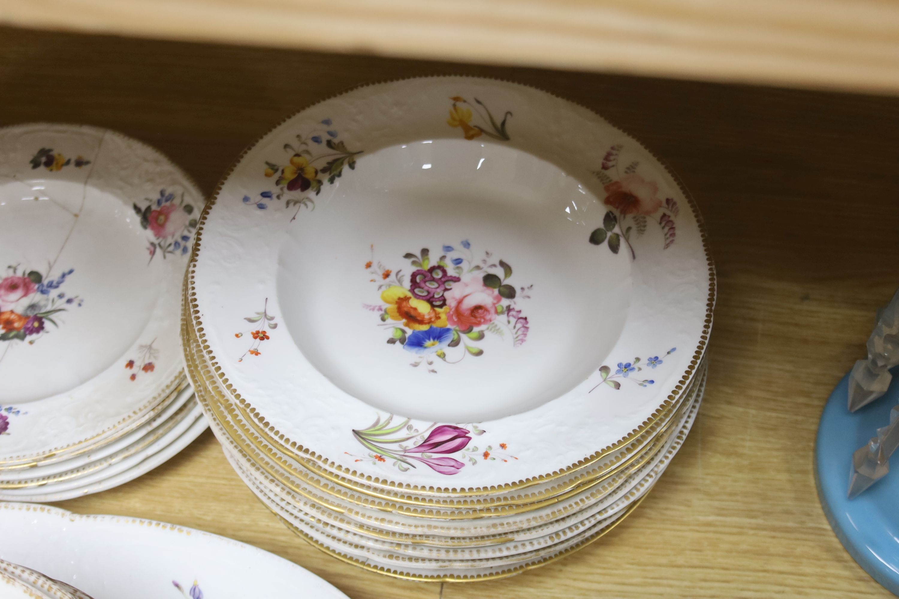 An English porcelain part dinner service, c.1825-30, and other similar plates